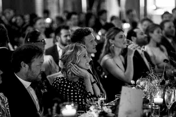 wedding guests looking at speakers during speeches