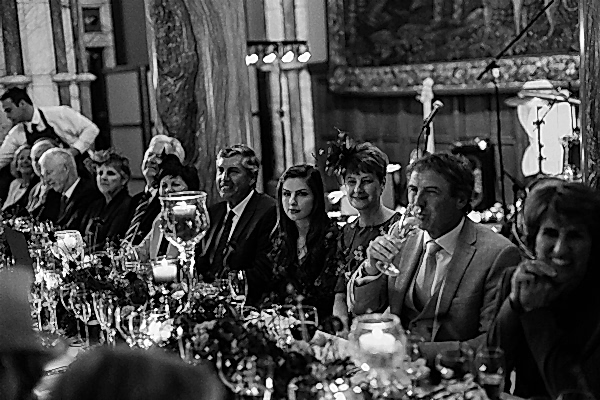 guests listening to wedding speeches