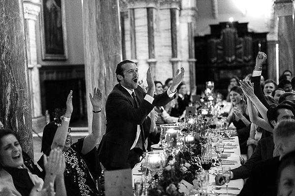 wedding guests clapping at reception