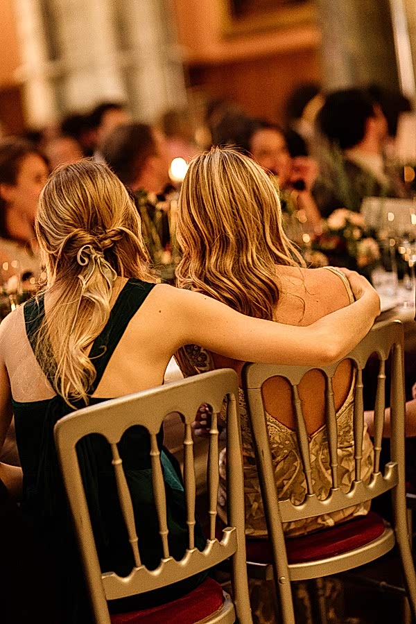 bride and bridemsate hugging at speeches