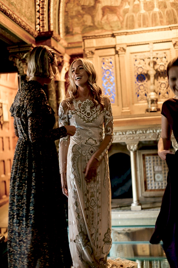 bride with friends in a golden chapel