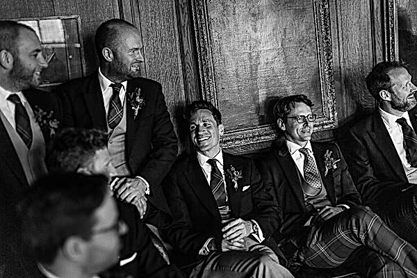 groomsmen laughing waiting