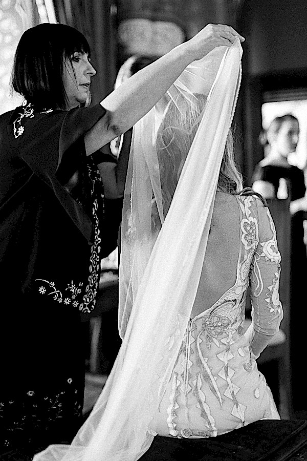 mother of the bride putting veil during preparations 