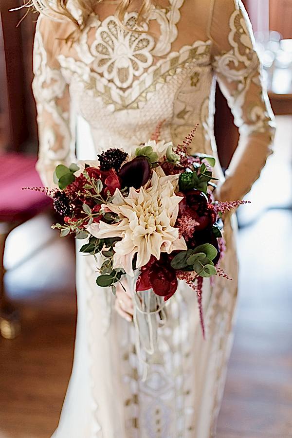 wedding flowers held by bride at mount stuart