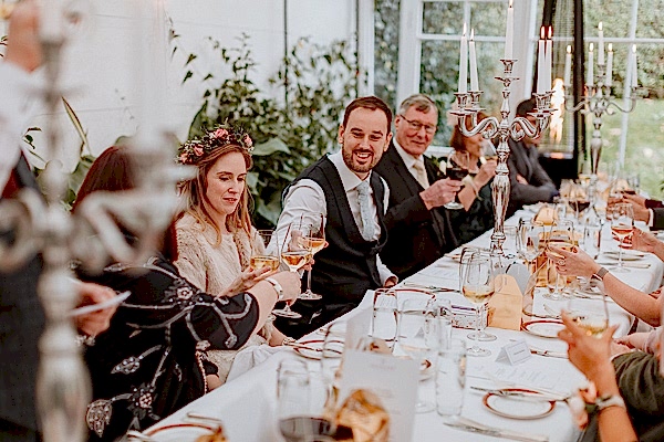 newlyweds raising toast wedding photographers ayshire