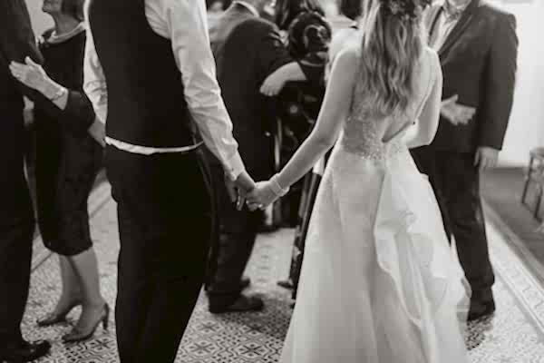 holding hands at the evenig reception in Glenapp Castle Estate 
