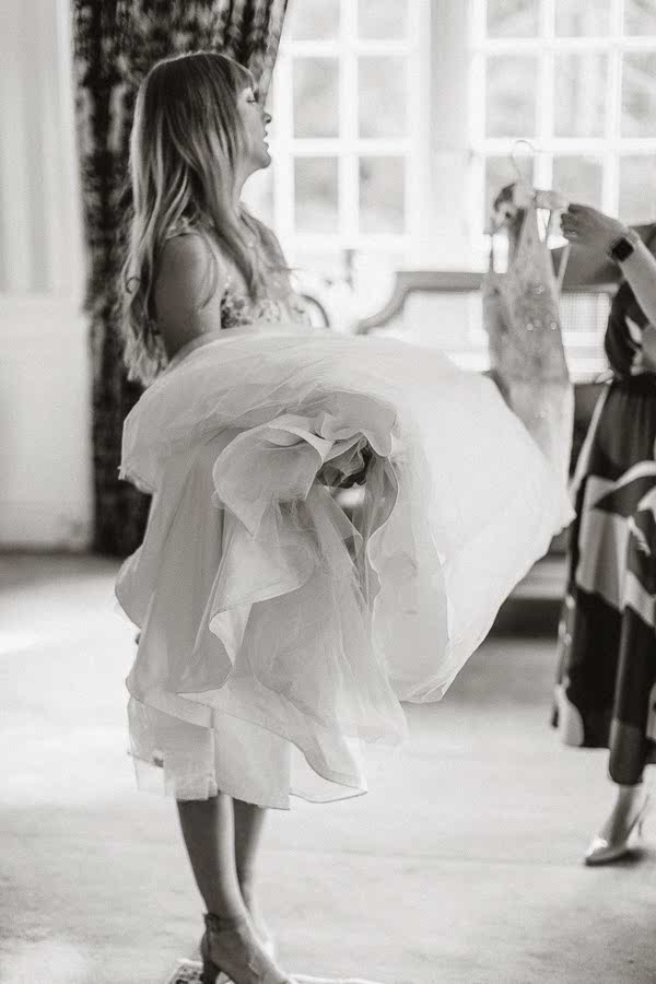 bridesmaid holding wedding dress Glenapp wedding venue 