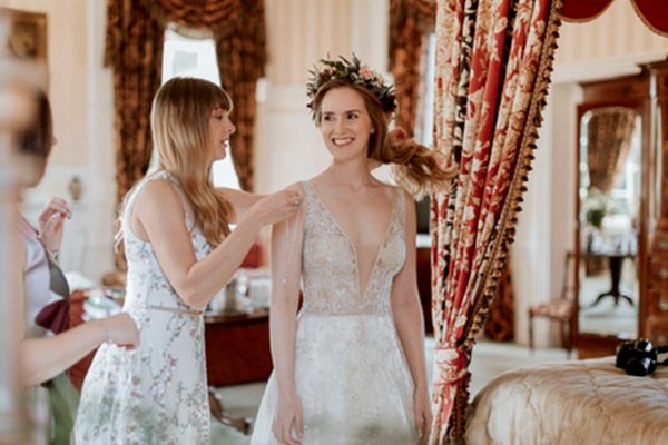 sister helping with a necklace at Glenapp Castle Wedding Photos 
