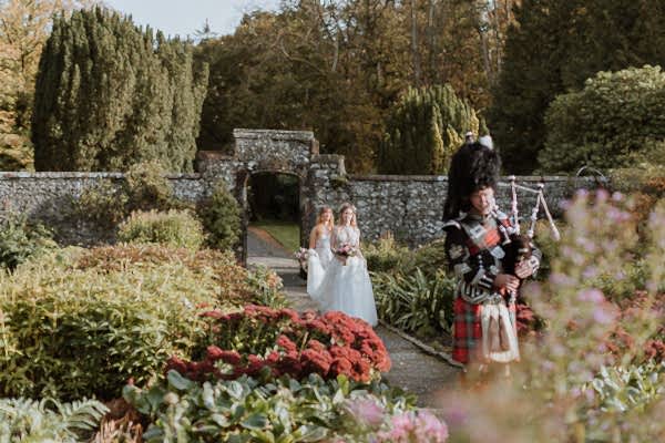 bride approaches a green house at Glenapp Castle Scotland