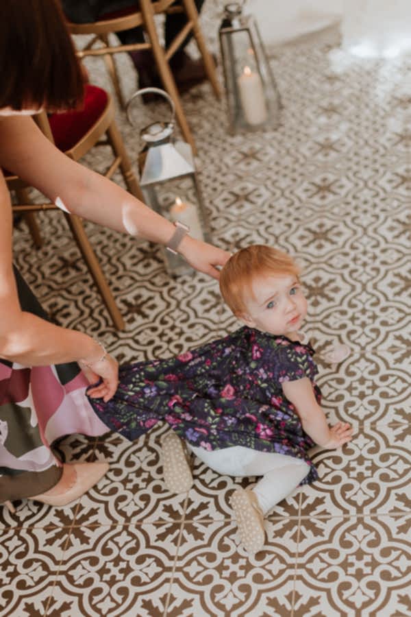 a little girl crawling during the ceremony at Glenapp Castle SCotland 