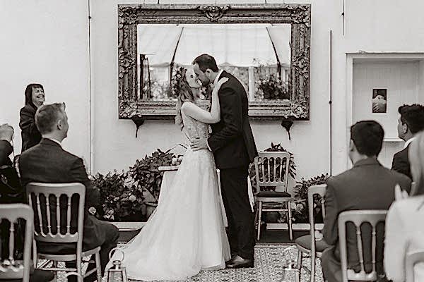 first kiss during a wedding at Glenapp Greenhouse