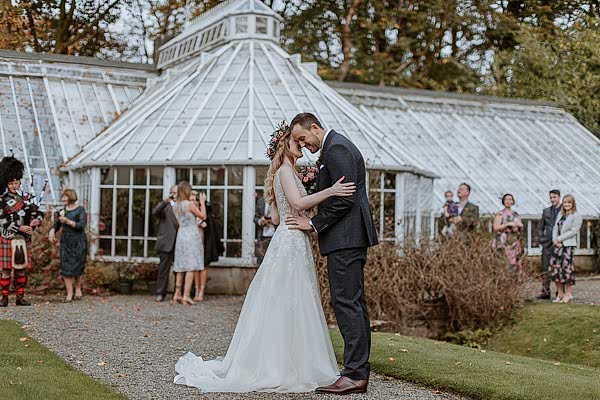 Bride and Groom freshly married outside of Greenhouse in Glenapp Estate 