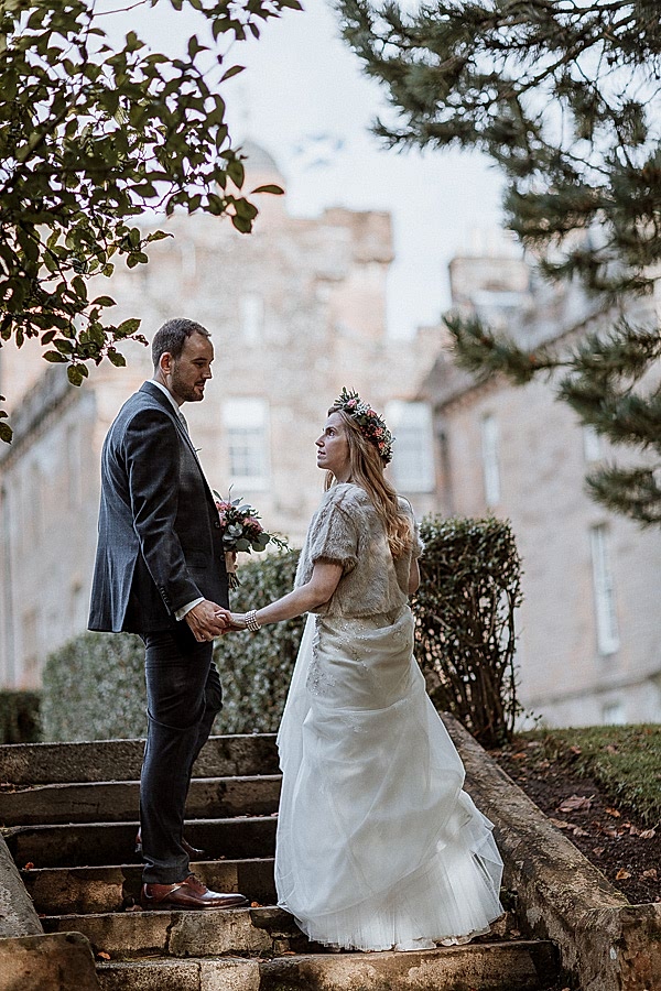 bride and groomn stopped on the steps at Glenapp Castle Ayrshire