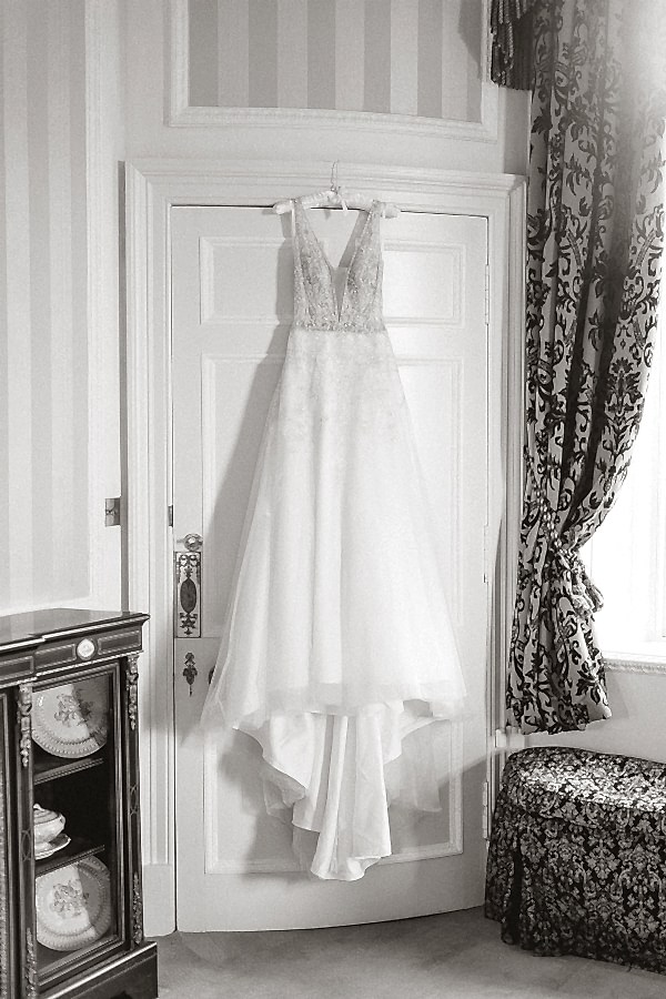 Wedding dress hang in a Glenapp Castle suite Scotland 