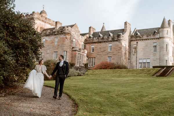 bride and groom in the front of Glenapp Castle Ayshire 