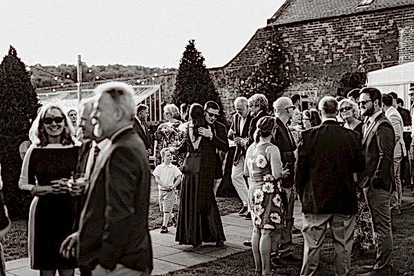 guests greeting bride to be at pre wedding party