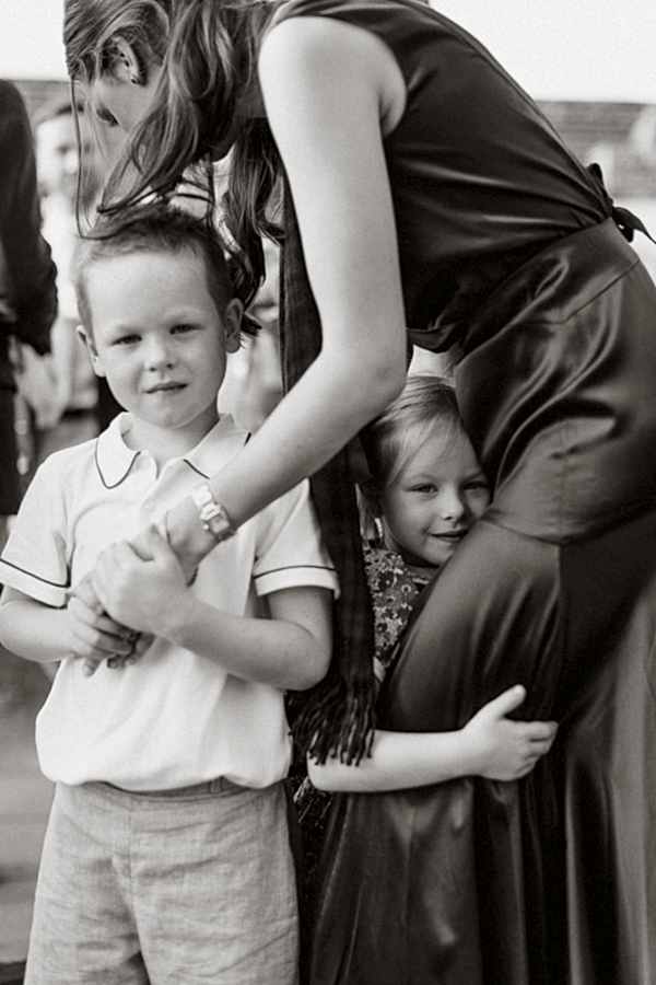 kids hunging bride to be at pre wedding party 