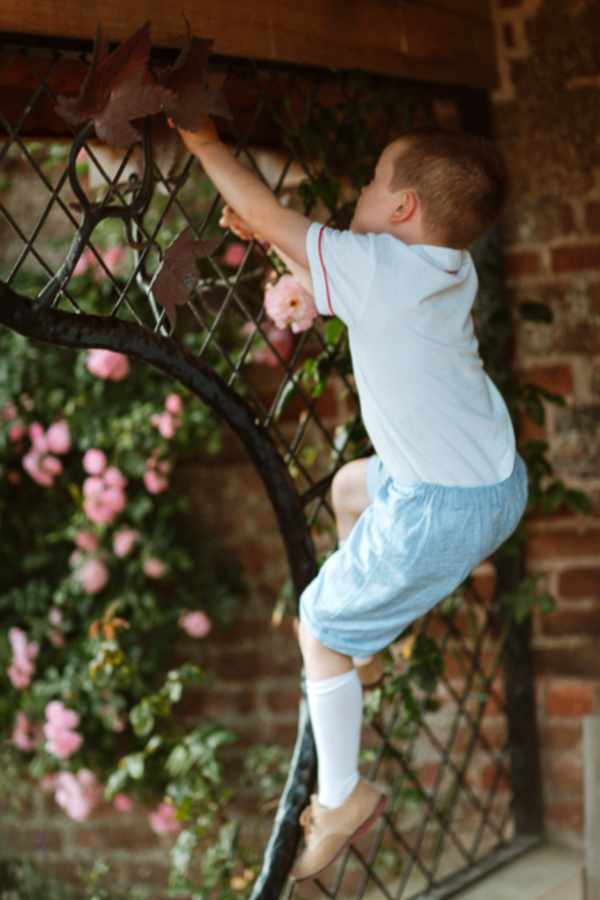 page boy climbing before wedding 
