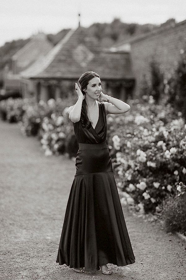 bride fixing her hair in the gardens of dumfries house