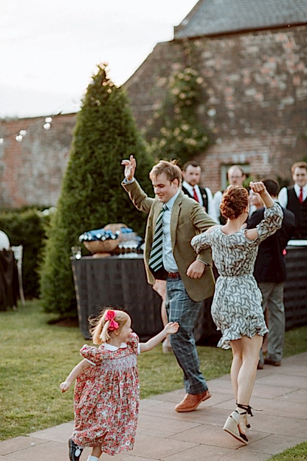 groom dancing with her sister outdoors at dumfries house