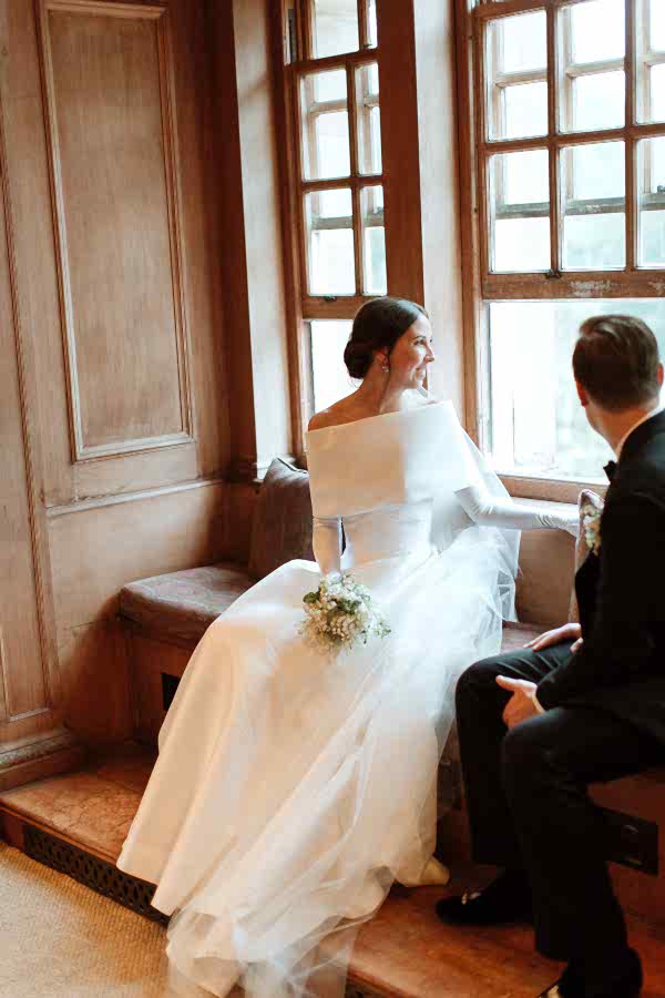 Dumfries House Wedding Photos newlyweds looking through the window