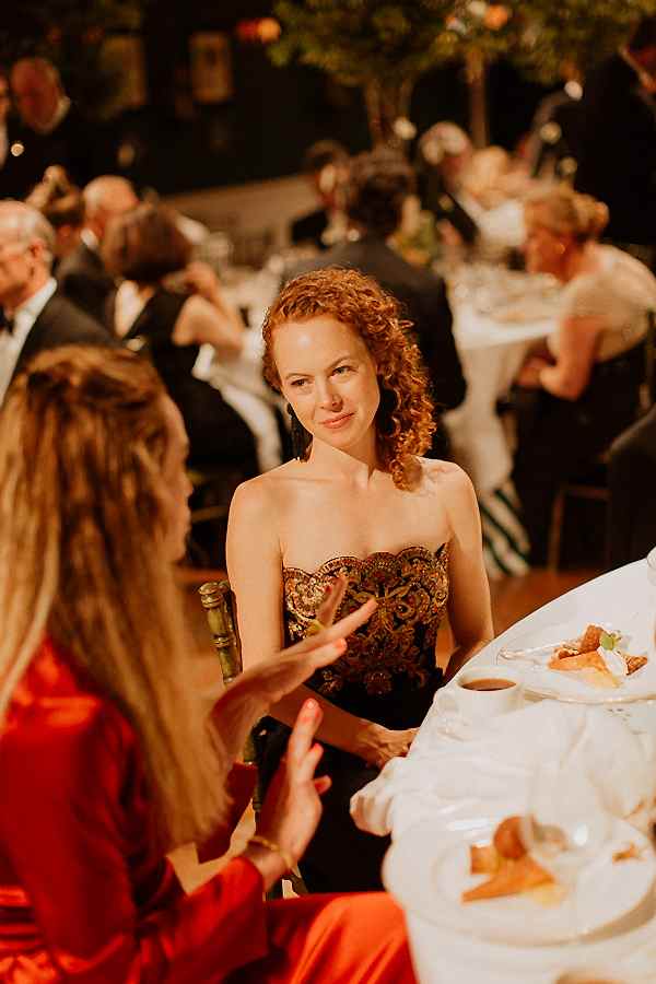 guests chatting at wedding 