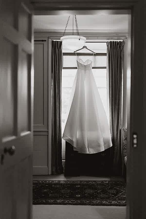 view of the room with dress hanging