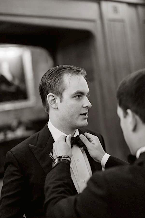 groom getting his bowtie fixed