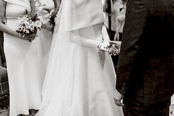 bride and groom holding hands during ceremony