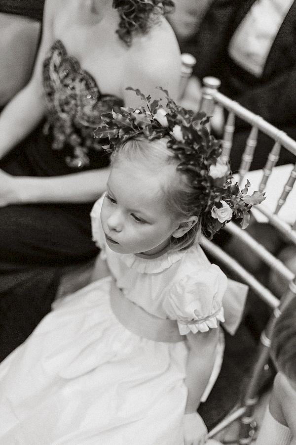 flowers girl sitting at ceremony