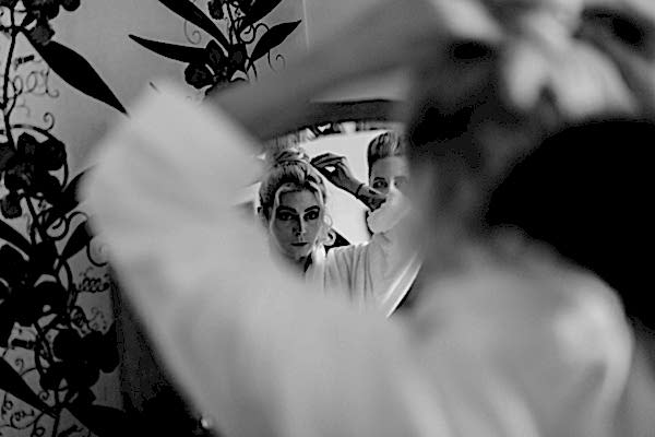 bridemaid doign her hair on the wedding day at the lodge 