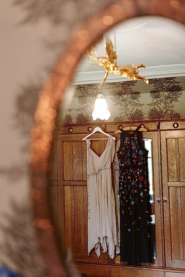 dresses hang in the bathroom at the lodge
